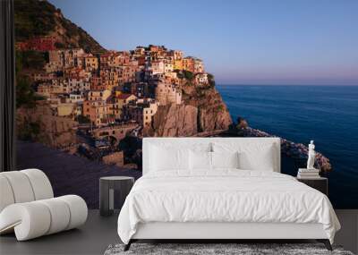 Colorful traditional houses on a cliff above the Mediterranean. roof in the foreground. Wall mural