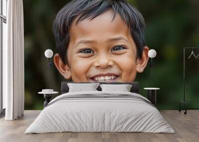 Content Thai kid with a beaming smile showing the inner happines Wall mural