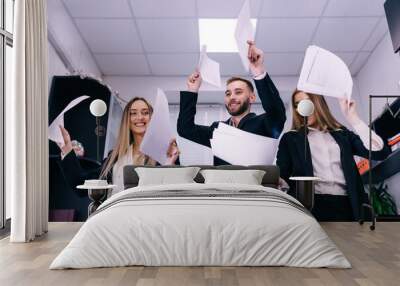 Excited happy carefree business team colleagues dancing together Wall mural