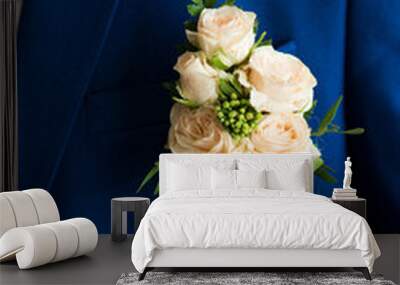 Flower boutonniere on the groom's jacket close-up Wall mural