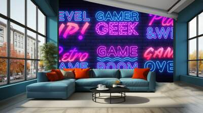 Gaming Neon signs set Vector. Gamer neon sign, design template, modern trend design, night signboard, night bright advertising, light banner, light art. Vector illustration Wall mural