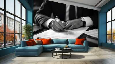 Job application and interview. Hands of a businessman or boss signing documents on the desk close-up in black and white colors
 Wall mural