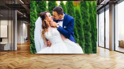 kissing couple on green background. wedding engagement concept Wall mural