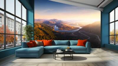 Flight over the autumn mountains with mountain road serpentine Wall mural