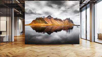 Incredible landscape of the famous Stokksnes mountains on Vestrahorn cape. Reflection in the clear water on the epic skies background, Iceland Wall mural