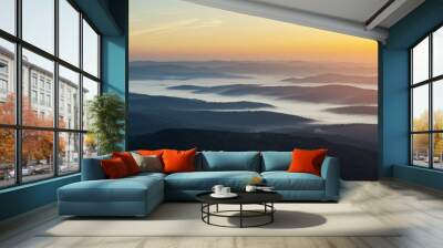 Morning fog in autumn mountains. Beautiful sunrise on background. Landscape photography panorama Wall mural