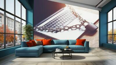 Locked chain on laptop as computer protection and cyber safety concept. Private data protection from hacker malware Wall mural