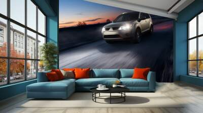 Car fast speed drive on asphalt road at dusk Wall mural