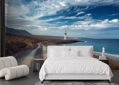 Lighthouse on a beautiful sea or ocean beach with waves and beautiful blue sky with white clouds
 Wall mural