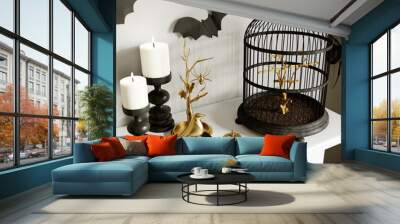 Modern Halloween living room interior. 3d rendering. The white shelf is festively decorated with a cage, bats and spiders. Wall mural