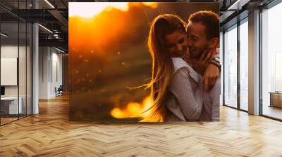 passionate hug of a couple in love on the shore of an evening la Wall mural