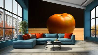 tomato on a wooden table in dark Wall mural