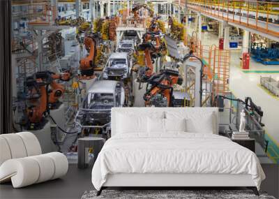 body of car on conveyor top view. Modern Assembly of cars at the plant. The automated build process of the car body Wall mural