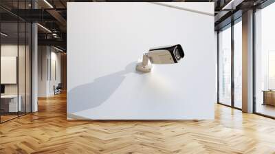 Bottom view of high-tech white video monitoring camera on smooth white wall Wall mural