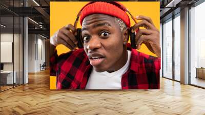 closeup portrait of a stylish black man in red headphones Wall mural