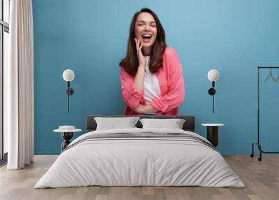 incredibly smiling happy young lady in a stylish summer look on a studio isolated background Wall mural