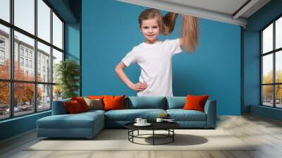 Little beauty girl in tee shirt with long brown hair Wall mural