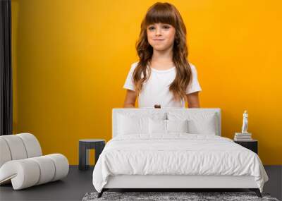 studio photo of an attractive caucasian girl on a yellow background Wall mural