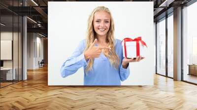 valentine's day concept. happy blond girl holding a gift in her hands on a white background Wall mural