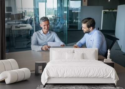 Two Businessmen Discussing Work in a Modern Office Wall mural