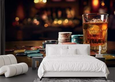 whiskey glass and poker chips on a table in a casino setting Wall mural