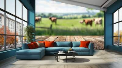 wooden table against the background of a green rural landscape with grazing cows in a meadow with space for text or inscriptions. Empty table in the meadow
 Wall mural