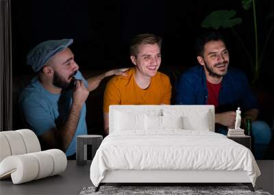 Group of friends watching sport game at home, cheering Wall mural