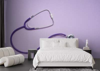 top view of stethoscope on a purple background. health check concept. medical concept. Wall mural