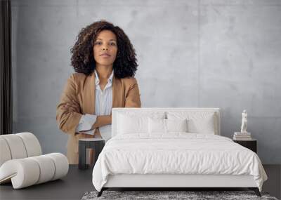 Beautiful young african american businesswoman posing on grey background Wall mural