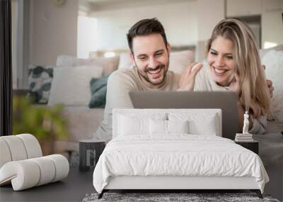 Couple having fun at home Wall mural