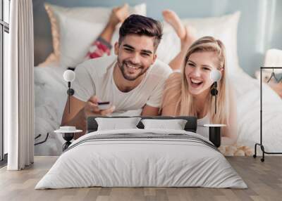 Cute couple watching TV Wall mural