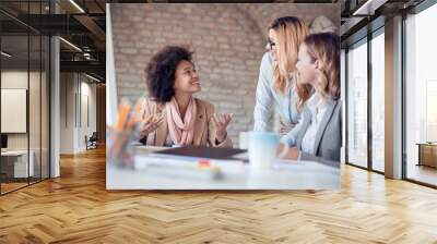 Group of young woman working together Wall mural