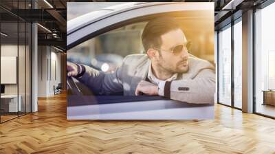 Handsome men in a car Wall mural