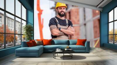 Portrait of young man with hard hat. Wall mural