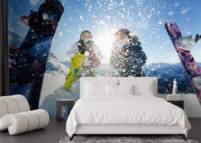 bride and groom in love throw snow background of the Alps Courch Wall mural