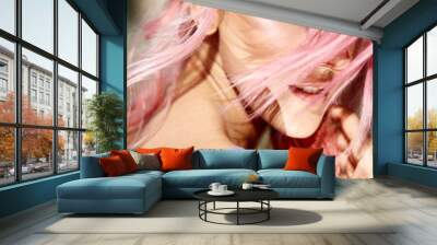 Gorgeous lady with pink hair whirls in violet silk robe Wall mural