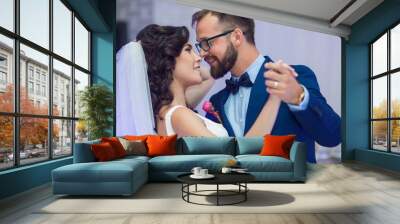 Happy newlywed couple smiling at their first dance at wedding re Wall mural