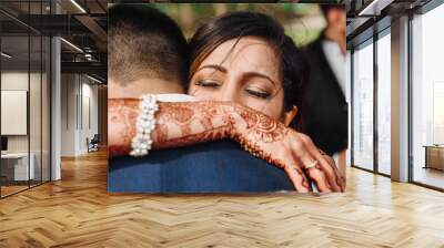 Indian bride and groom hug each other tender after the wedding ceremony Wall mural