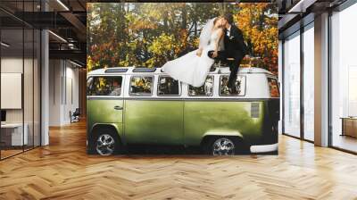 merry happy young couple on the background fabulous autumn fores Wall mural