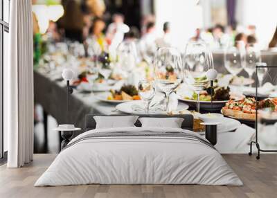 Sparkling glassware stands on long table prepared for wedding di Wall mural