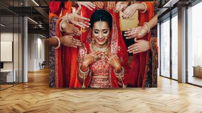 stunning indian bride dressed in hindu traditional wedding clothes lehenga embroidered with gold and Wall mural