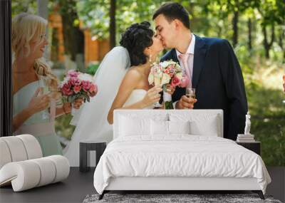 The brides kissing in the park Wall mural