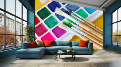 paint brushes and bright water colours palette Wall mural