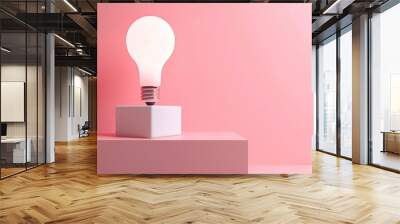 Light bulb on a white cube against a pink background, minimal design concept Wall mural