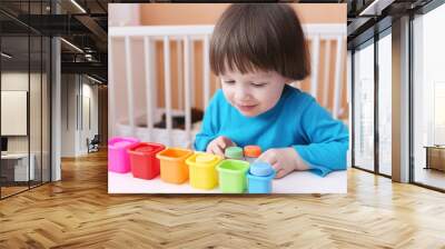 lovely 2 years boy sorts toys by color Wall mural