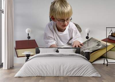 boy is reading books Wall mural