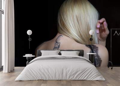 Girl back view. A girl has a tattoo on her neck. The tattoo symbol is a dream catcher.	 Wall mural