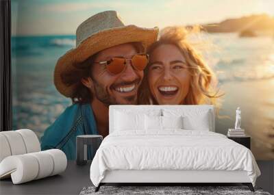 A happy casual couple are enjoying a summer vacation on the beach. Wall mural