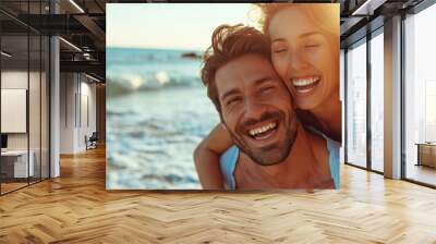 A happy casual couple are enjoying a summer vacation on the beach. Wall mural