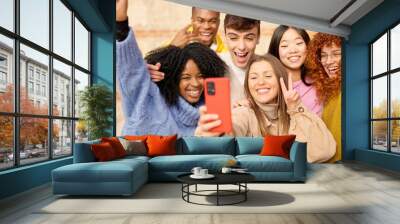 Diverse teenager people taking a selfie celebrating something very happy Wall mural